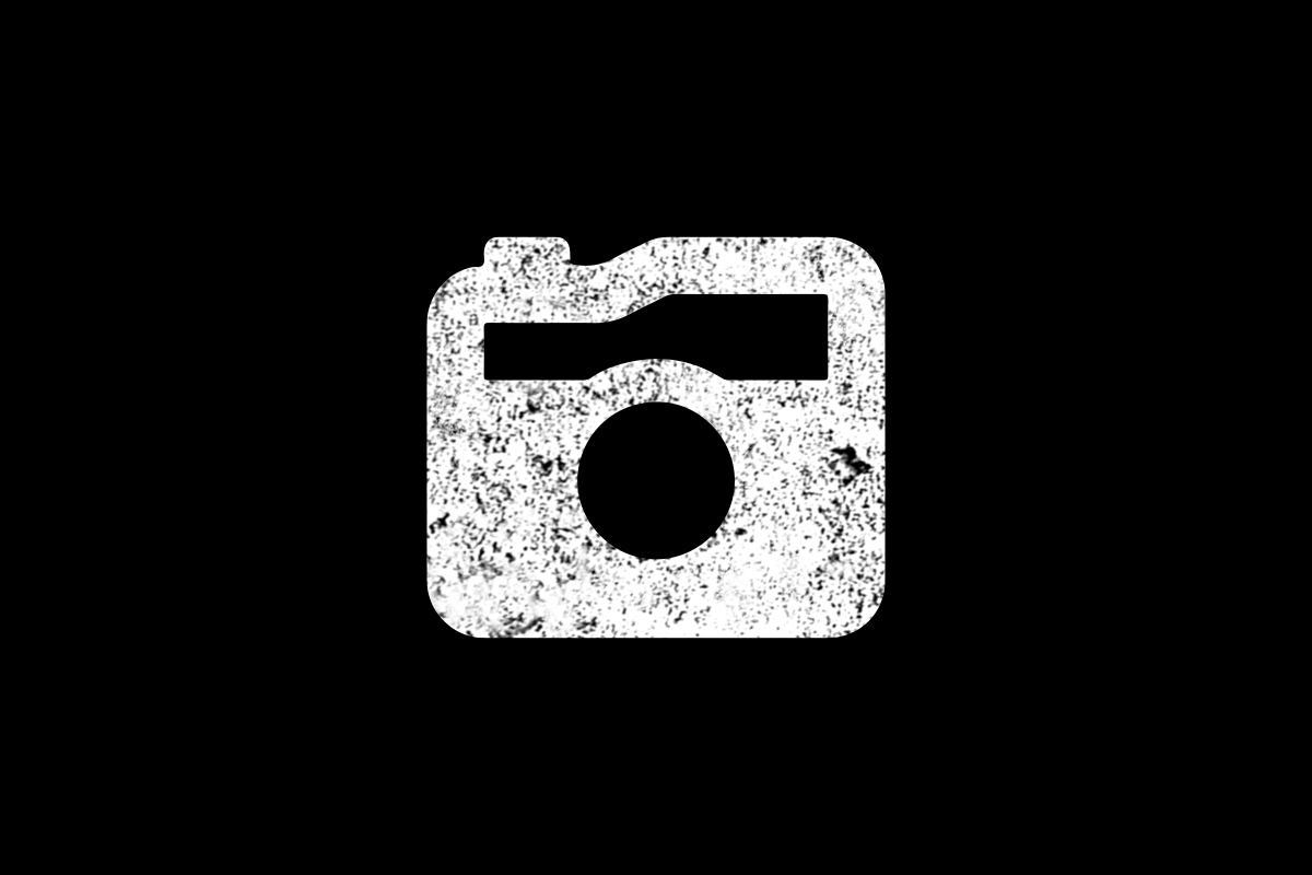 Weißes Kamera Icon auf schwarzem Grund